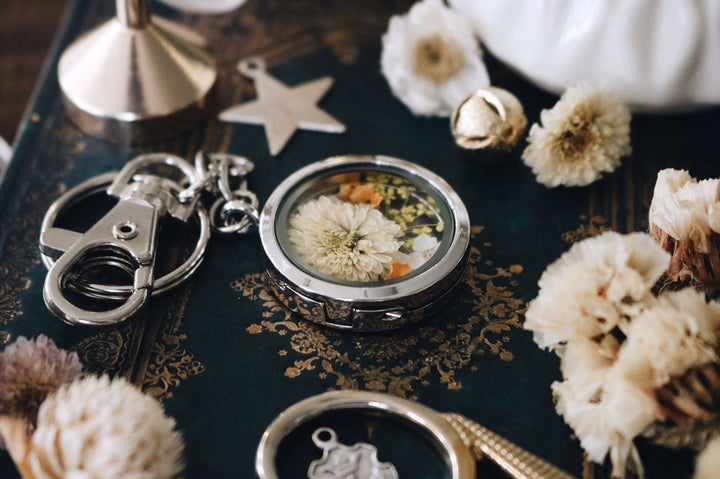 White Carnation flower with yellow queen anne lace and freesia leaf silver locket keychain