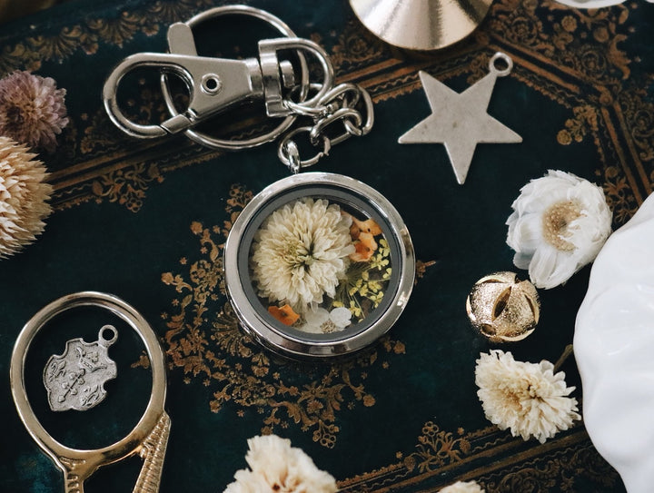 White Carnation flower with yellow queen anne lace and freesia leaf silver locket keychain